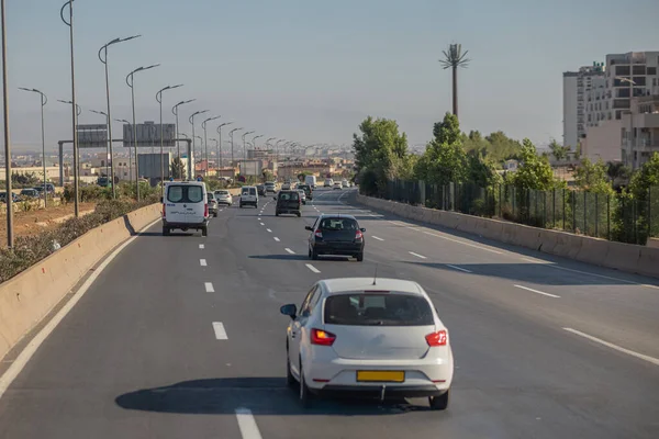 Motorway in algeria, around the city of Oran. View of cars in african city traveling on multi lane highway..