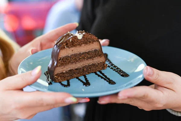 Tasty deserts and ice cream. Girls and boys holding deserts. Delicious decorated deserts on plates