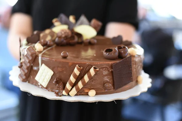 Tasty deserts and ice cream. Girls and boys holding deserts. Delicious decorated deserts on plates