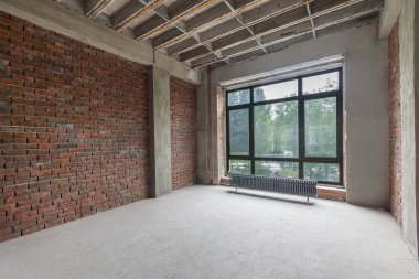 A small room without decoration with a window. Prepared for finishing.
