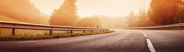 Black Asphalt Road Dividing Line Safety Fence Morning Mist Highway —  Fotos de Stock