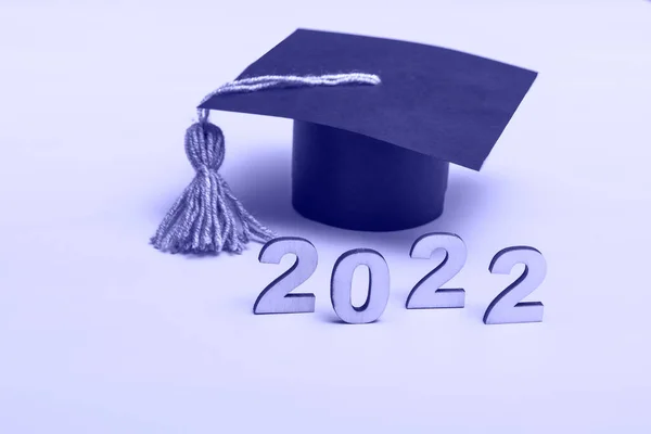 Gift box in the form of a graduation cap. 2022 release concept on very peri background with copy space