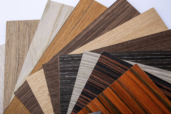 A thin sheaf of wood. Lots of samples. Interior design industry. Close up with copy space.