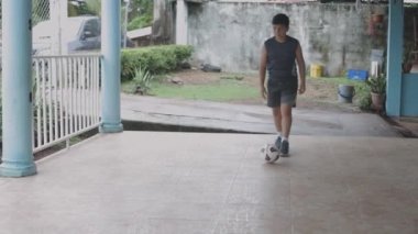 child playing home alone futball