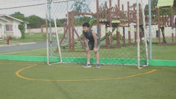 Latin Boy Goal Catching Soccer Ball — Stock Video