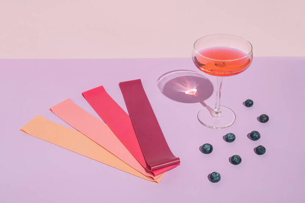 Modern minimal summer fitness concept with cocktail glass, fruit