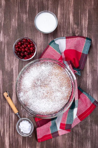 Swedish saffron Kladdkaka, pie with white chocolate, whipping cream and cranberry, vertical, top — Stock Photo, Image