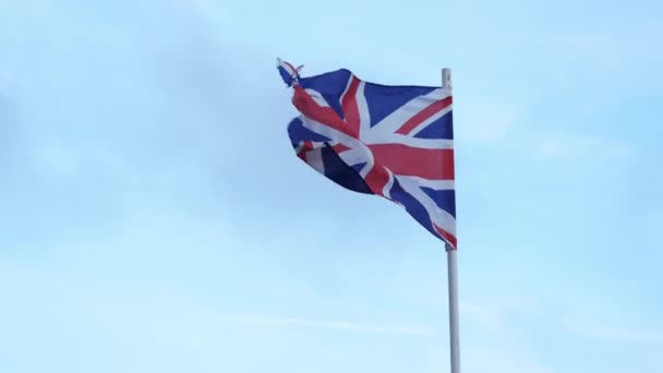 Lightly Battered British Flag Waving Wind Blue Sky Background Union — Vídeo de Stock