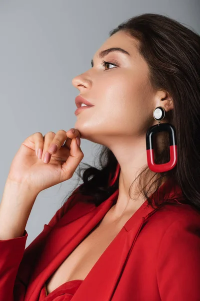 Side View Trendy Woman Red Suit Earring Posing Isolated Grey — Stock Photo, Image