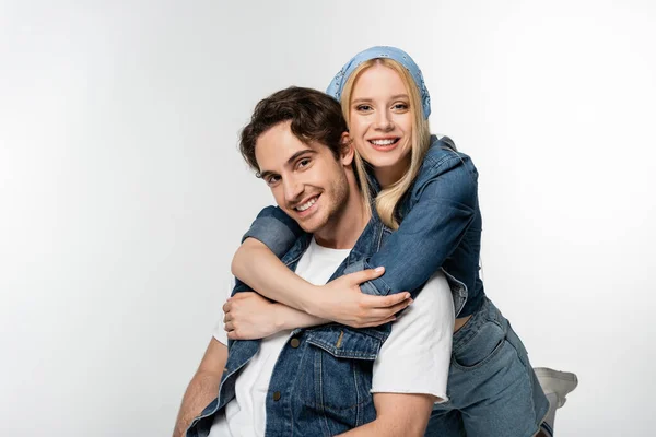 Cheerful Couple Denim Clothes Embracing While Smiling Camera Isolated White — Stock Photo, Image