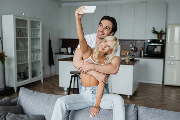 Happy Woman Taking Selfie Cheerful Boyfriend Living Room — Stock Photo, Image