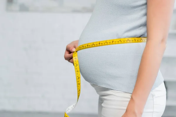 Partial View Pregnant Woman Estimating Size Belly Measuring Tape — Stock Photo, Image