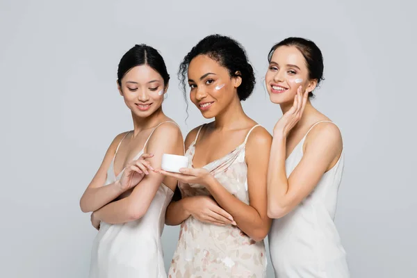 Positive African American Woman Holding Container Cream Interracial Friends Isolated — Stock Photo, Image