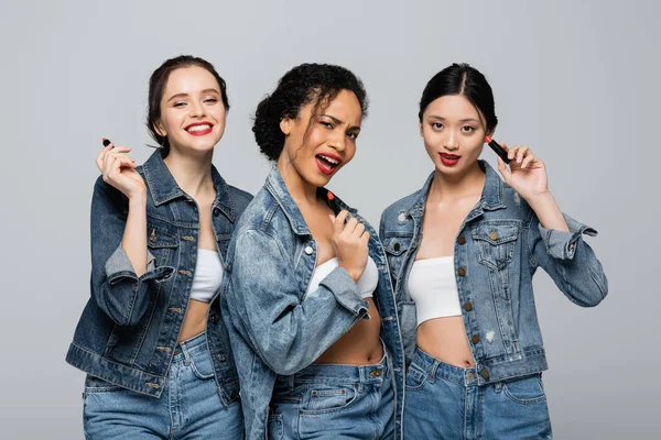African American Woman Holding Red Lipsticks Interracial Friends Denim Jackets — Stock Photo, Image