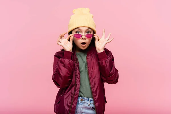 Surprised Preteen Girl Trendy Outfit Adjusting Sunglasses Isolated Pink — Stock Photo, Image