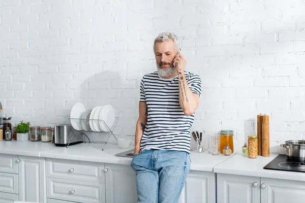 Middle Aged Man Talking Cellphone Worktop Kitchen — Stock Photo, Image