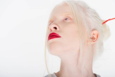 Portrait of albino woman with red lips looking away isolated on white clipart