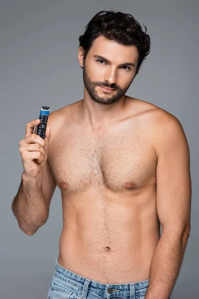 Young Shirtless Man Holding Electric Razor Looking Camera Isolated Grey — Stock Photo, Image