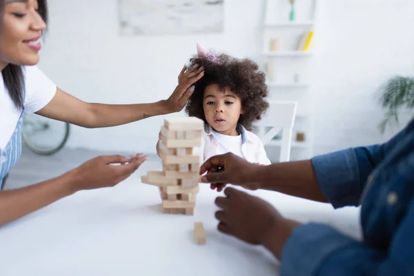 African American Girl Party Cap Playing Wood Blocks Game Blurred — Stock Photo, Image
