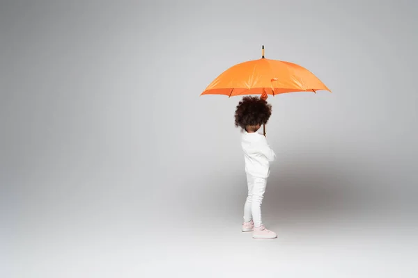 African American Child White Long Sleeve Shirt Pants Standing Orange — Stock Photo, Image