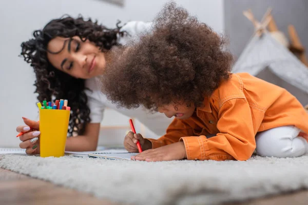 African American Child Drawing Notebook Blurred Mom Home — Stock Photo, Image