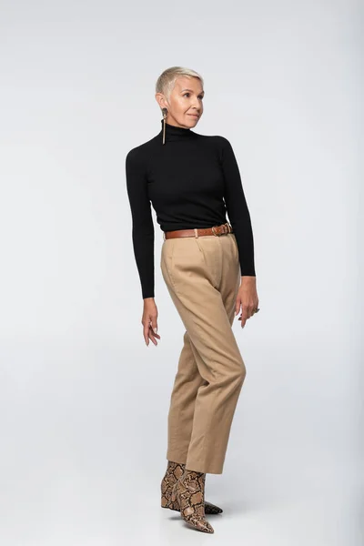 Full Length Stylish Senior Woman Beige Pants Black Turtleneck Animal — Stock Photo, Image