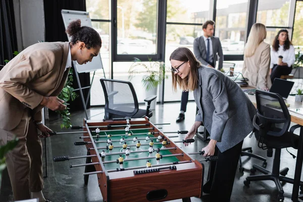 Young Businesswoman Smiling While Playing Table Football African American Colleague — Stock Photo, Image