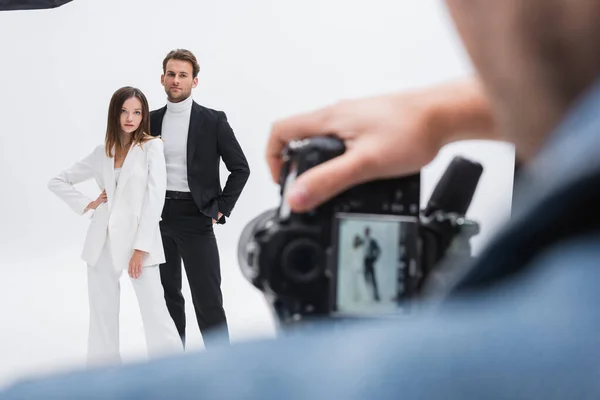 Blurred Photographer Working Young Trendy Models Posing White — Stock Photo, Image