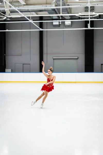 Full Length Young Woman Figure Skating Gesturing Professional Ice Arena — Stock Photo, Image