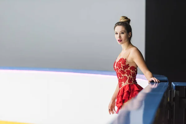 Young Figure Skater Red Dress Standing Ice Rink — Stock Photo, Image
