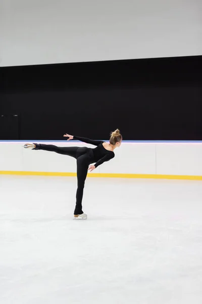 Back View Professional Figure Skater Black Bodysuit Skating Outstretched Hand — Stock Photo, Image