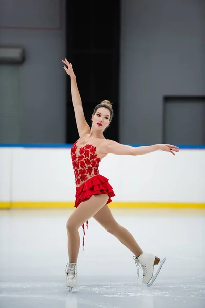 Full Length Woman Red Dress Figure Skating Outstretched Hands Ice — Stock Photo, Image