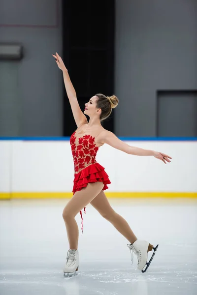 Side View Happy Woman Red Dress Figure Skating Outstretched Hands — Stock Photo, Image