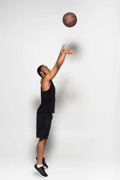 Full Length Muscular African American Man Throwing Basketball While Playing — Stock Photo, Image