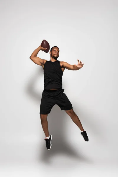 Full Length African American Sportsman Playing Rugby Jumping Grey — Stock Photo, Image