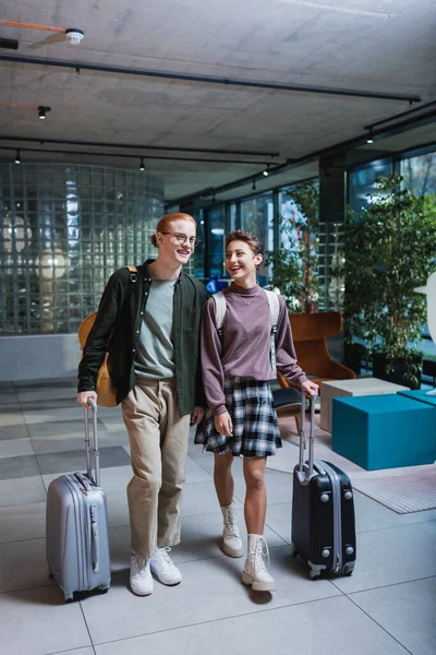Positive Couple Baggage Walking Hotel Lobby — Stockfoto