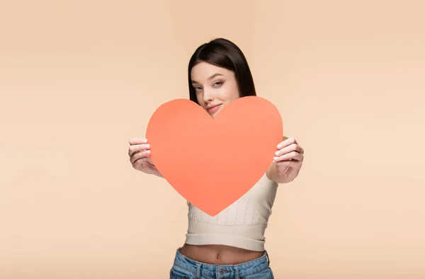 Blurred Joyful Woman Holding Red Paper Heart Isolated Beige — Stock Photo, Image