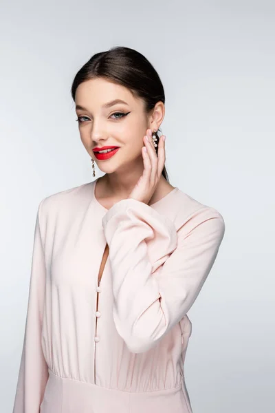 Joyful Woman Earrings Blouse Looking Camera Isolated Grey — Stock Photo, Image