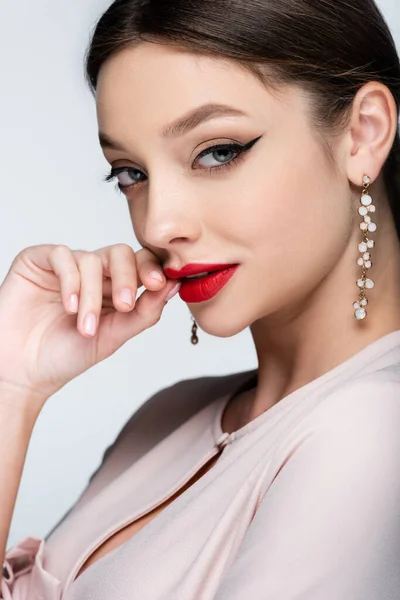 Flirty Woman Earrings Posing Isolated Grey — Zdjęcie stockowe