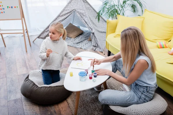 Kid Holding Paintbrush Mother Gouache Home — Stock Photo, Image