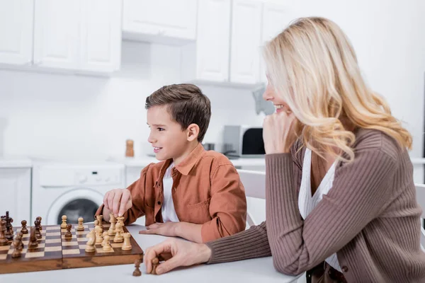 Positive Boy Playing Chess Granny Kitchen — Stock Photo, Image