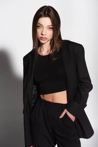 Stylish Woman Black Top Suit Posing Hand Pocket Grey Shadow — Stock Photo, Image