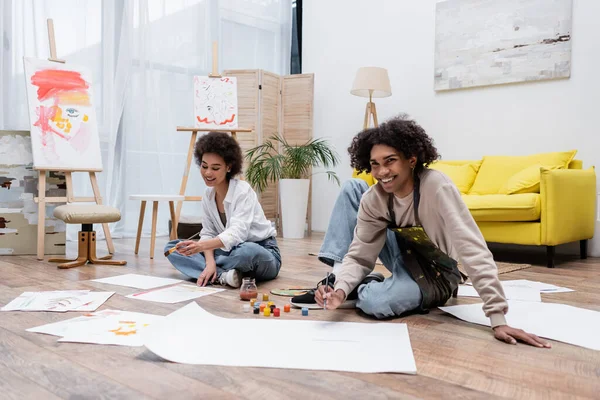Cheerful Young African American Couple Painting Floor Home — Stock Photo, Image