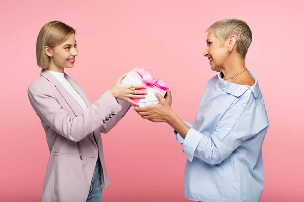 Happy Woman Giving Wrapped Present Cheerful Mature Mother Isolated Pink — Stock Photo, Image