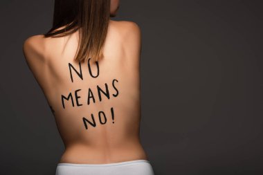 back view of cropped woman with no means no phrase written on body isolated on dark grey clipart