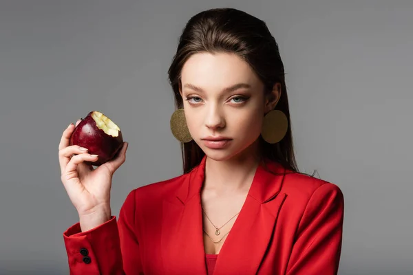 Trendy Young Woman Red Blazer Earrings Holding Apple Isolated Grey — Stock Photo, Image