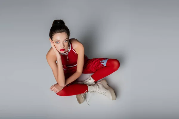 Top View Trendy Young Model Red Sportive Outfit Boots Sitting — Stock Photo, Image