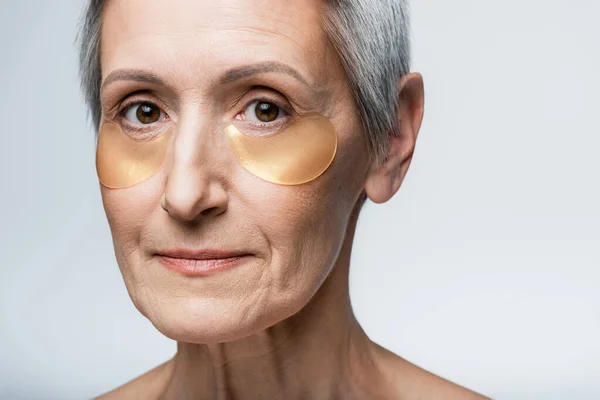 Close Middle Aged Woman Hydrogel Eye Patches Looking Camera Isolated — Stock Photo, Image