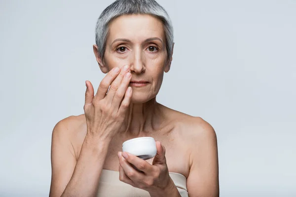 Mature Woman Grey Hair Holding Container Applying Cosmetic Cream Isolated — Stock Photo, Image
