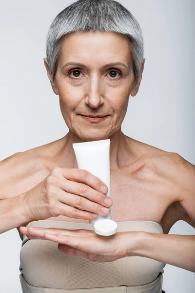 Middle Aged Woman Grey Hair Holding Tube Applying Lotion Hand — Stock Photo, Image